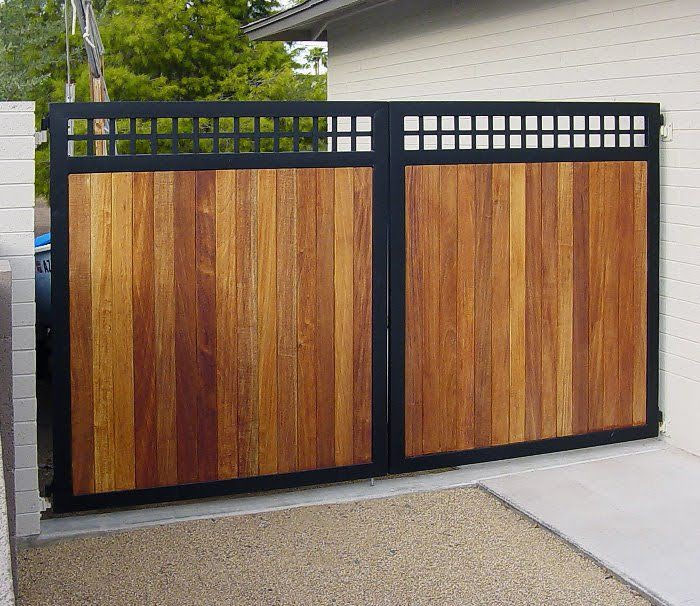 Wood-panel gate with a dark metal frame